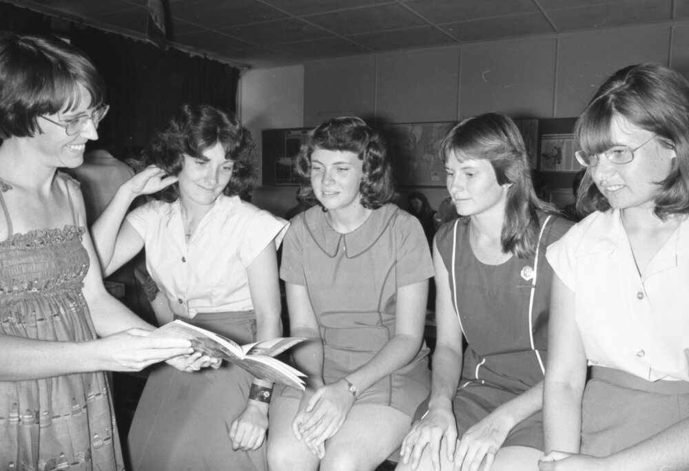 Four unidentified female Ipswich State High School students with a teacher in a classroom, Brassall, Ipswich, February 1978