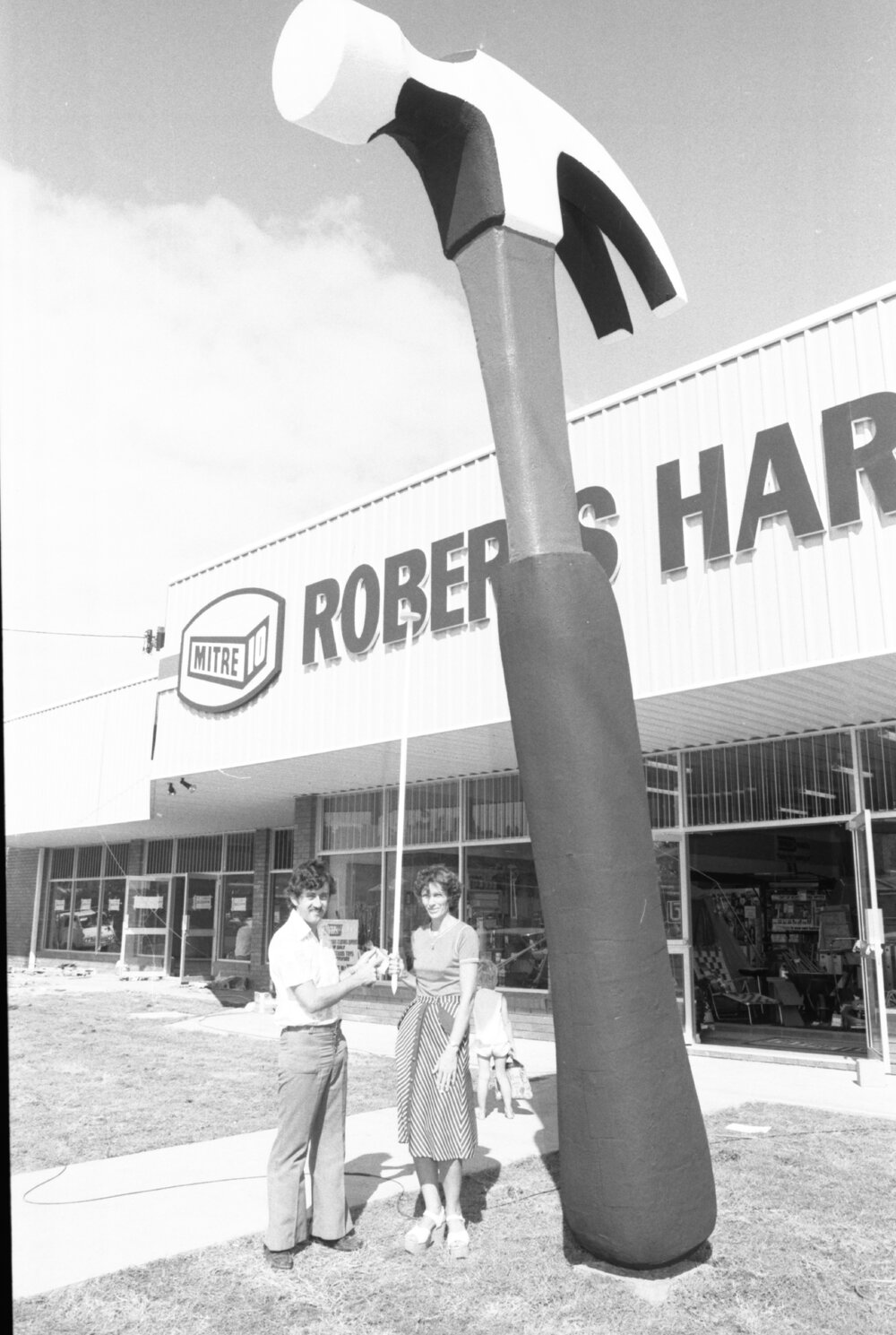 Thought to be John and Margaret Roberts with Giant Hammer outside Roberts Hardware Store, Bundamba, Ipswich, March 1978