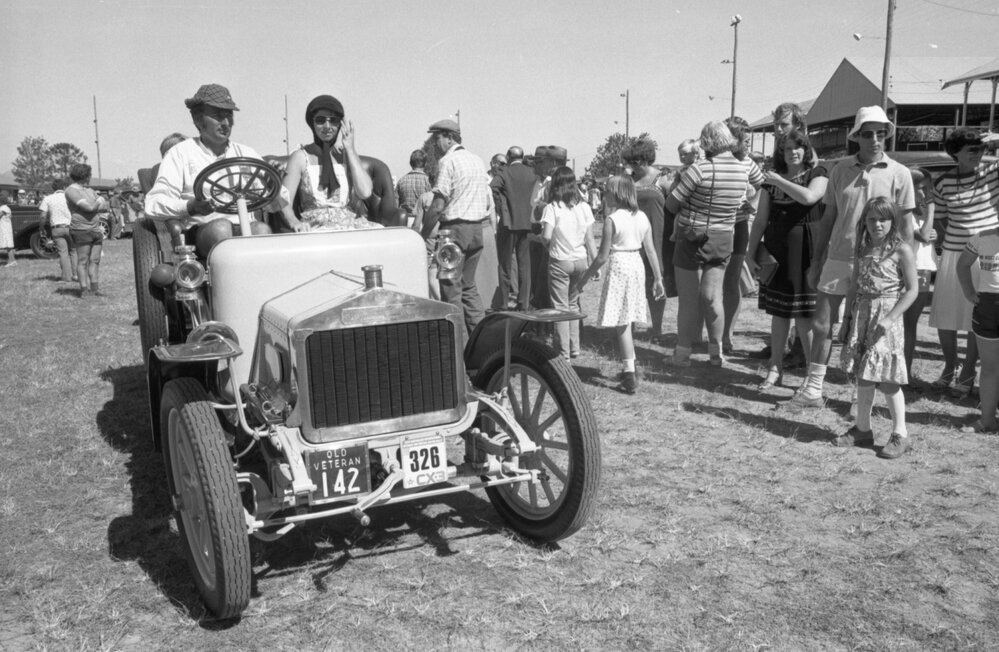 Man and woman in veteran car at the 1978 Australian International Veteran and Vintage Motor Rally at the Ipswich Showgrounds, Ipswich, April 1978