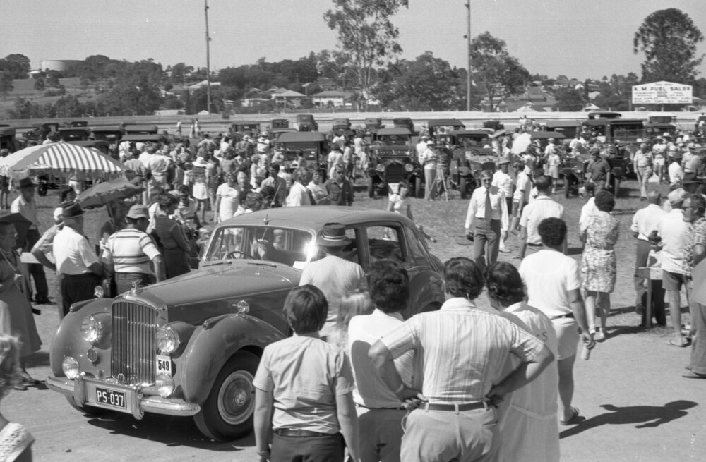 Vintage Rolls Royce Car driving through crowd at the 1978 Australian International Veteran and Vintage Motor Rally at the Ipswich Showgrounds, Ipswich, April 1978