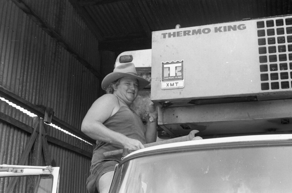 Mechanic working on Thermo King device on truck at the 1979 Queensland Times Off-Road Spectacular, Minden, Somerset, November 1979