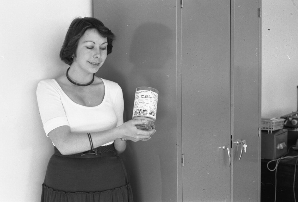 Gayle holding a C.B.'er glass covered in trucker jargon, Ipswich, 14th October 1977