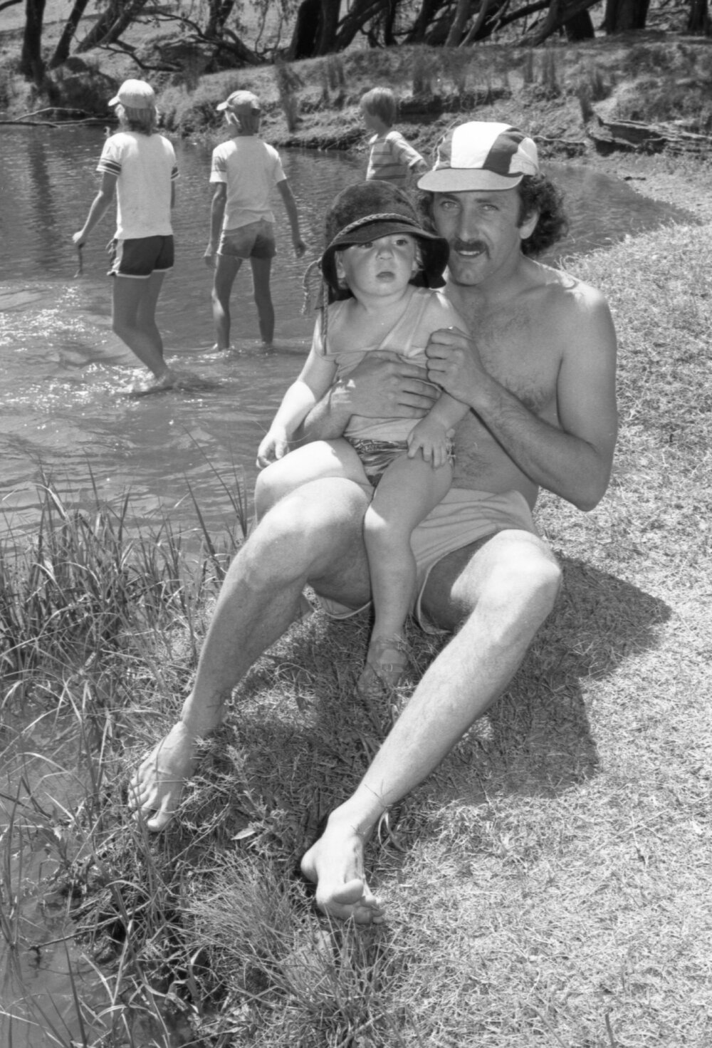Father and his boy by the river, Ipswich, 16th October 1977