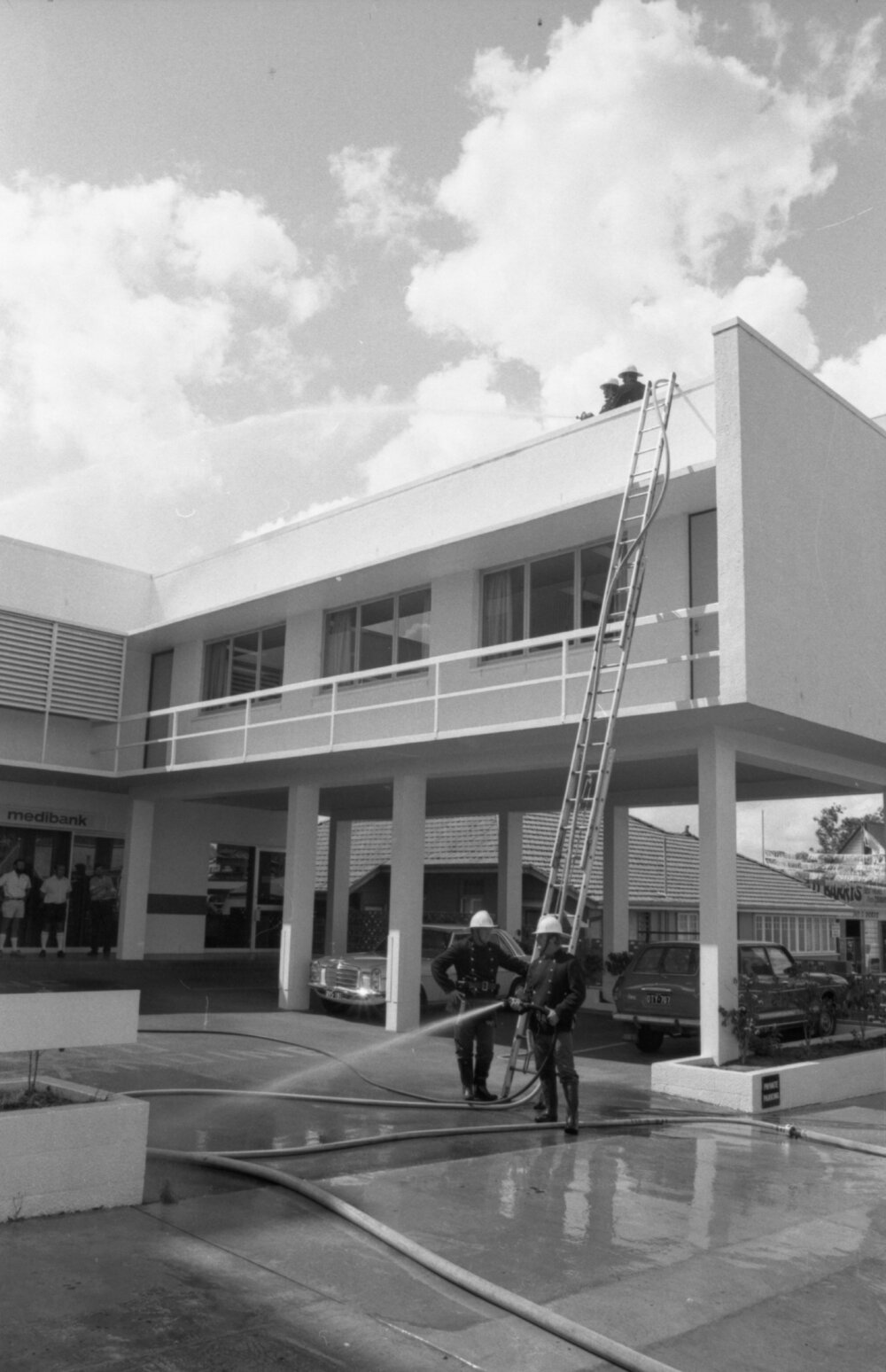 Fire fighters practicing a fire drill, Ipswich, October 1977