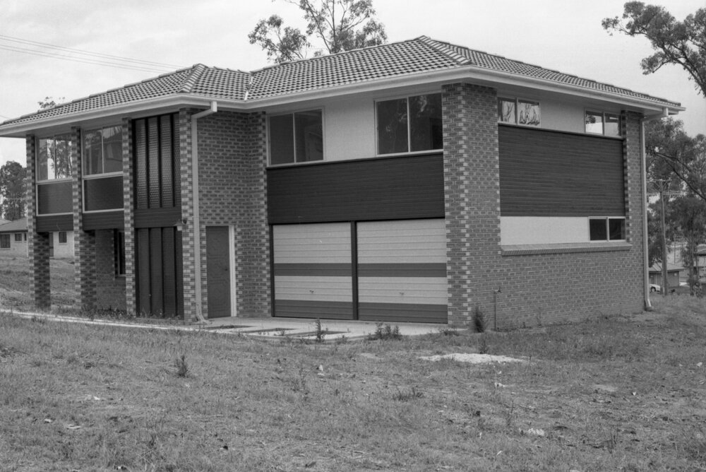 Two storey brick house with bullion bottle glass windows, Collingwood Park, October 1977