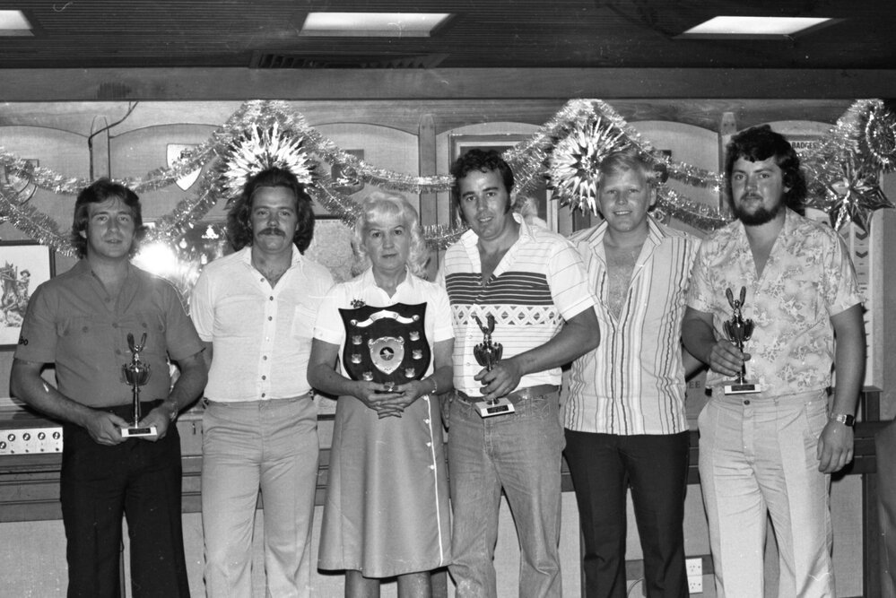 Unidentified people with trophies and a shield award, Ipswich, December 1979