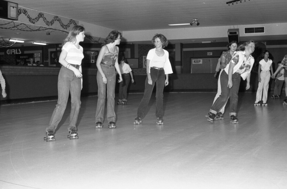 Women roller skating, thought to be at Skate-A-Way, Ipswich, September 1980