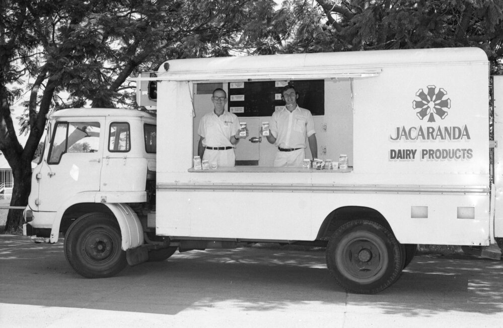 Two men with the Jacaranda milk truck, Ipswich, March 1978