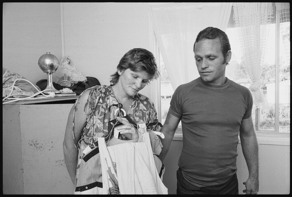 Unidentified couple holding clothes, Ipswich, January 1986