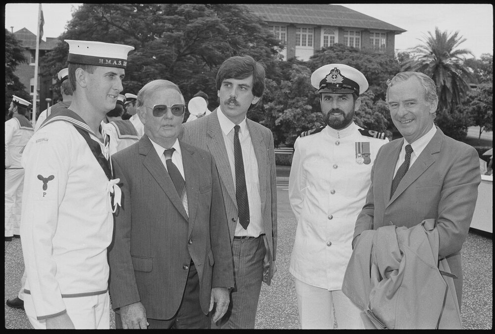 Darren Harkins, Mayor Desmond Freeman, David Hamill, thought to be Commanding Officer Lieutenant Commander Darren Grogan, and Bill Hayden commemorating the 'HMAS Ipswich' receiving the 'Freedom of Entry to the City', Ipswich, January 1986