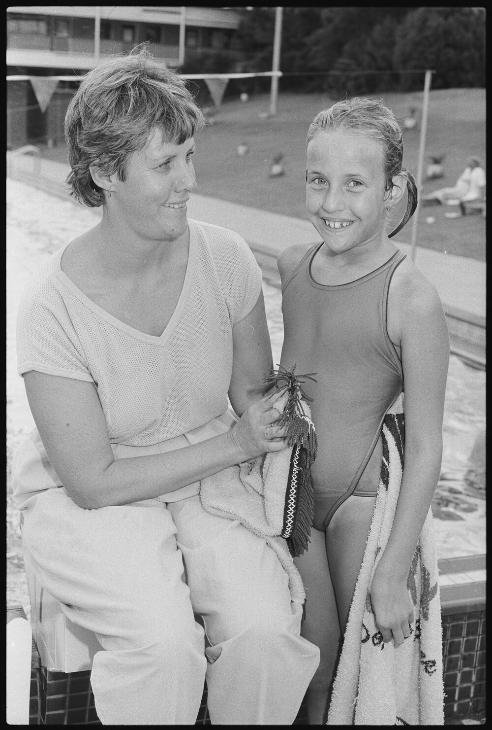 Unidentified swimmers at swimming pool, January 1986