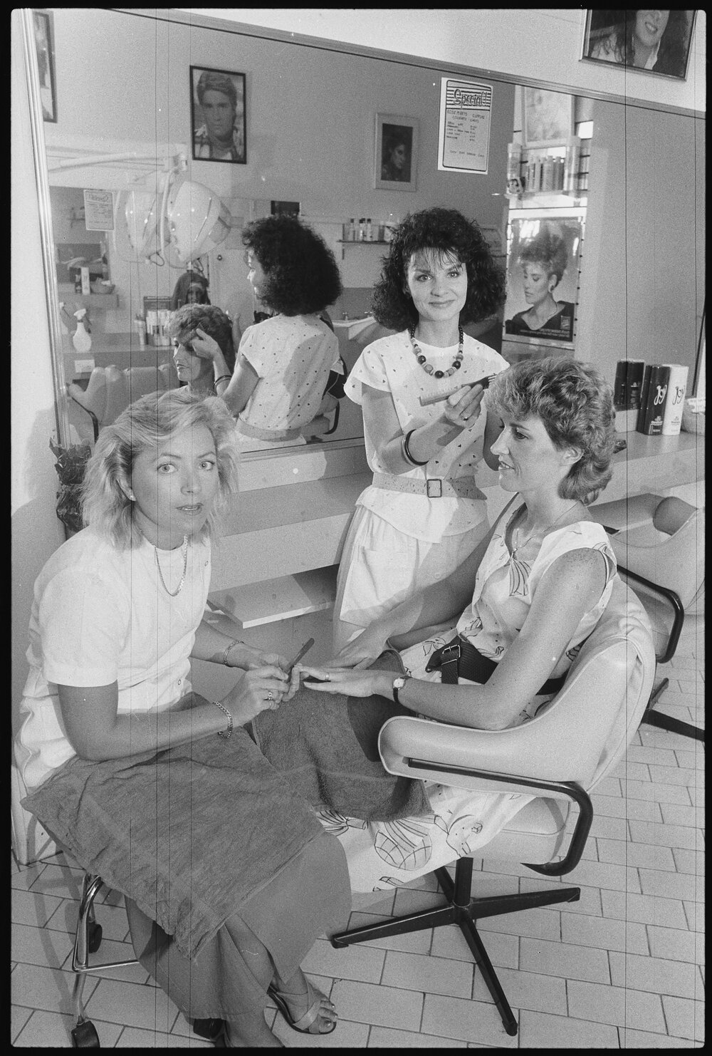Hairdressing salon with a client, Ipswich, 1986