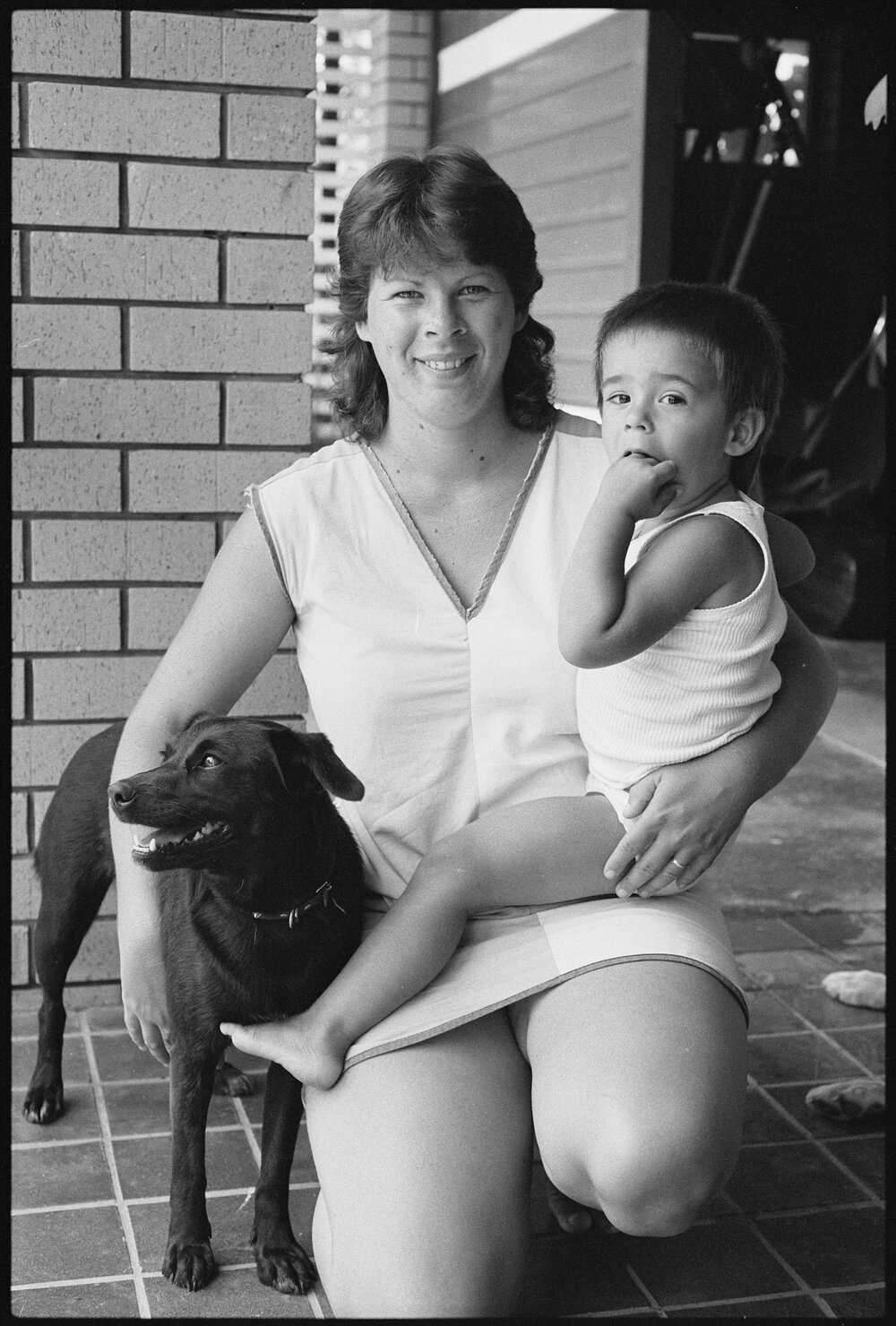 Unidentified mother and child and pet dog, Ipswich, January 1986