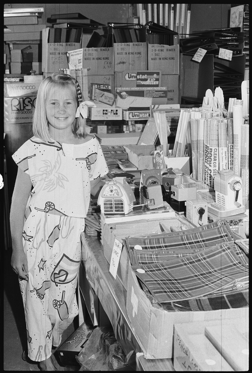 Unidentified child in a stationery shop possibly for back to school, Ipswich, 1986 