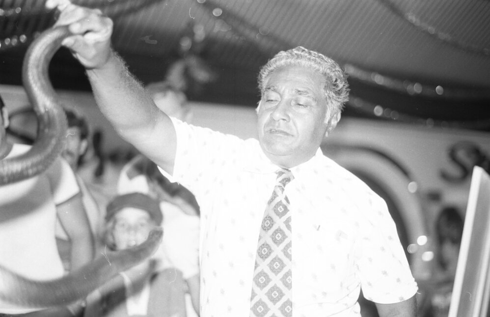 Ram Chandra holds Snake in Snake Demonstration in shopping arcade, Ipswich, December 1979