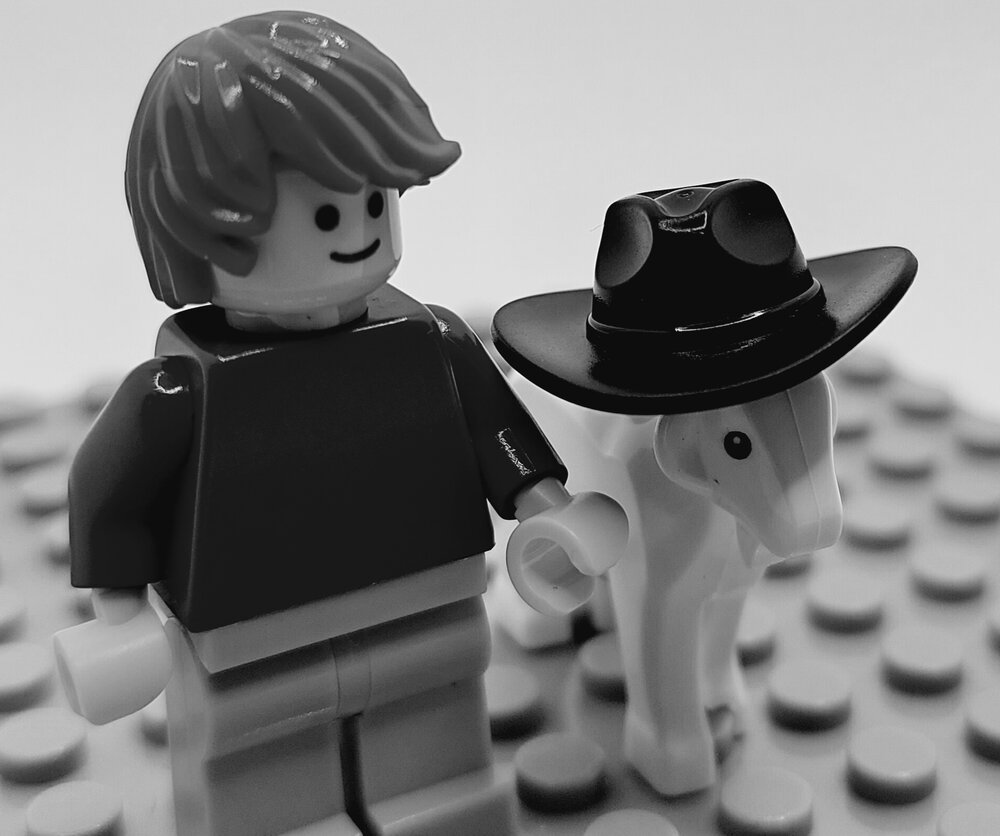 Brickswich version of Girl putting a hat on a billy goat, Ipswich, from 1977