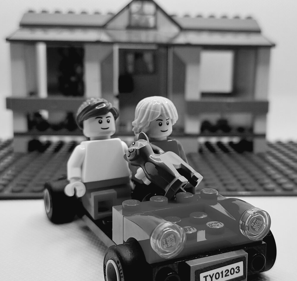Brickswich version of children on toy car in backyard at 7 Alice Street, Blackstone, late 1940s