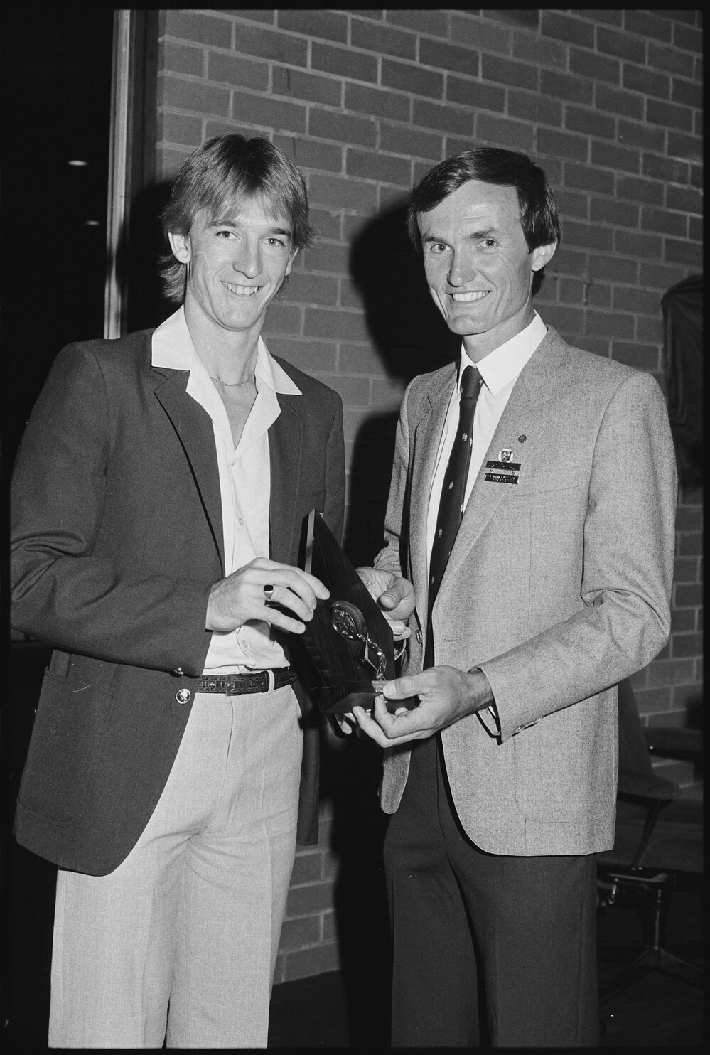Neil William Russell of Moreton Shire Council presenting an unidentified person a Citizen Award for Australia Day, Ipswich, January 1986 