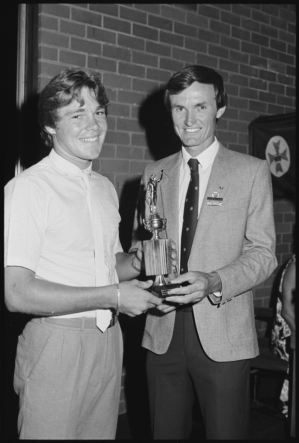 Neil William Russell of Moreton Shire Council presenting an unidentified person a Citizen Award for Australia Day, Ipswich, January 1986 