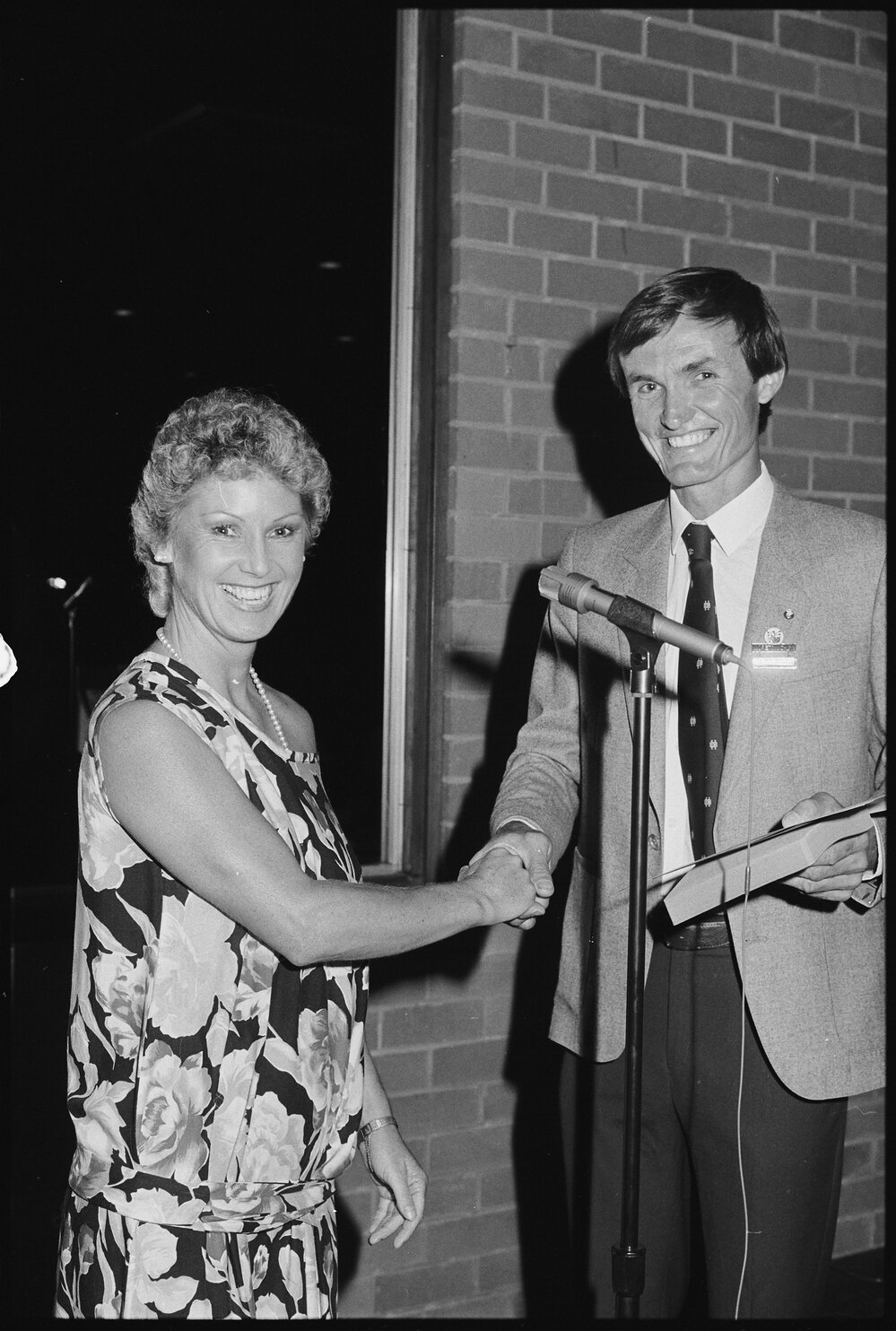 Neil William Russell, of Moreton Shire Council, presenting a Certificate of Australian Citizenship, to Jennifer Jones, Australia Day, Ipswich, January 1986 
