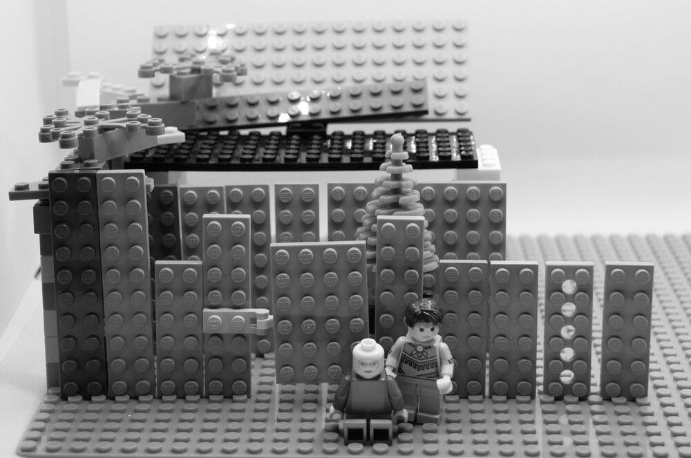 Brickswich version of mother and child in front of house in the Ipswich area, from the 1890s