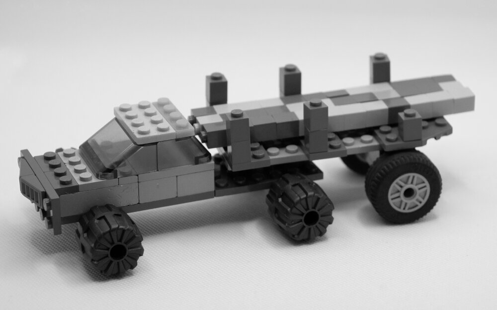 Brickswich version of a loaded logging truck at Kruger Sawmill, Byrne Street, Bundamba, from 1959