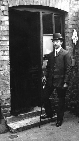 Bert Roberts standing in doorway, location unknown, n.d.