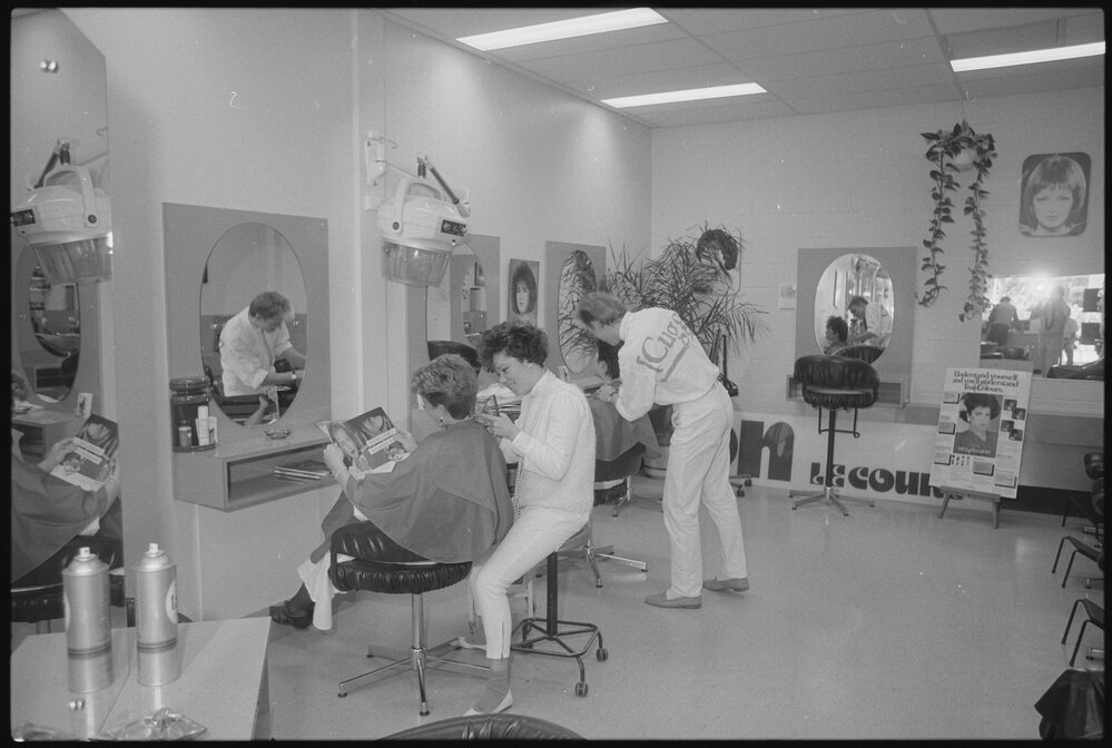 Clients being worked on by hairstylists at the Jon Le Court Hairdressers in Ipswich Grand Plaza, Ipswich, August 1985