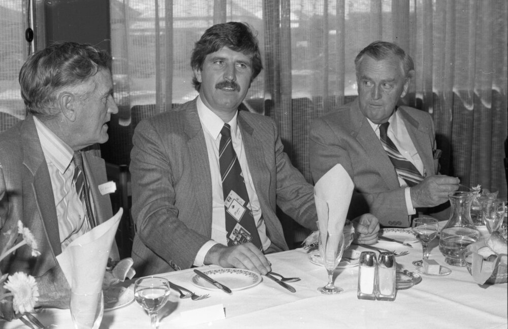 Premier Joh Bjelke-Petersen sitting with Bill Gunn and unidentified man during a formal visit, Ipswich, August 1980