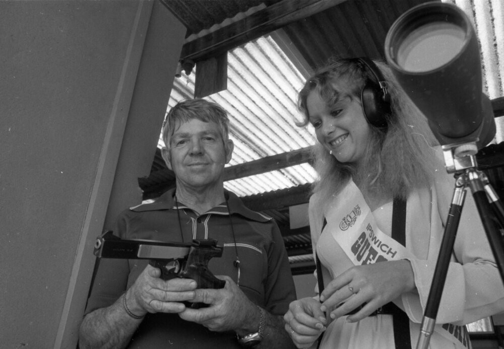 Unidentified man teaching unidentified Quest Entrant about firearms, Ipswich, August 1980