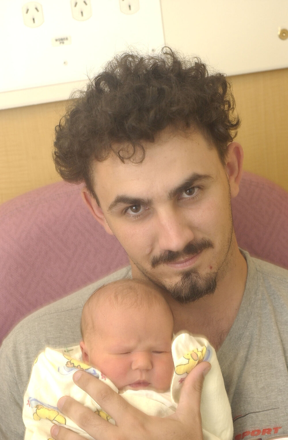Man with newborn baby (Mia Dean-Brooks), Ipswich, December 2003