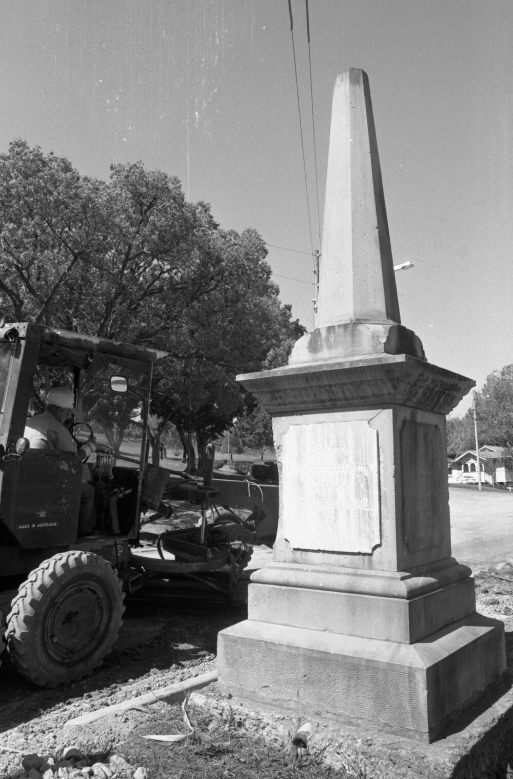 Men working around a monument, Ipswich, September 1980