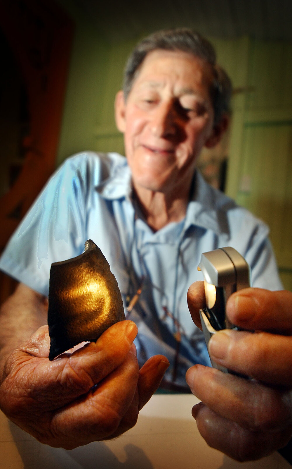 Bob Deering with a piece of the bomb he found in White Rock, Ipswich, September 2003