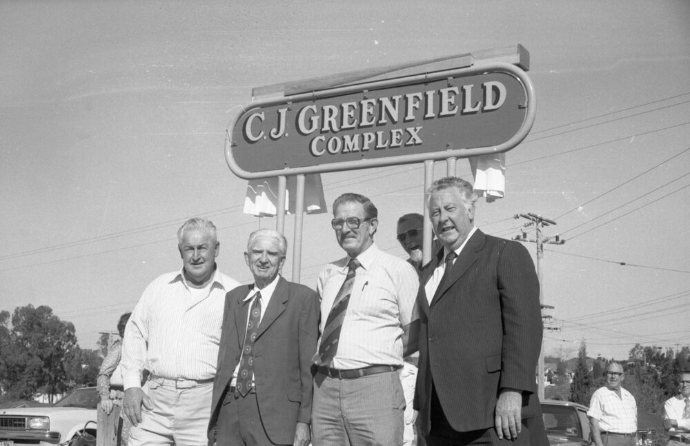 Unidentified people planting a tree at the opening of the C. J. Greenfield Sports Complex, Richlands, Ipswich, September 1980