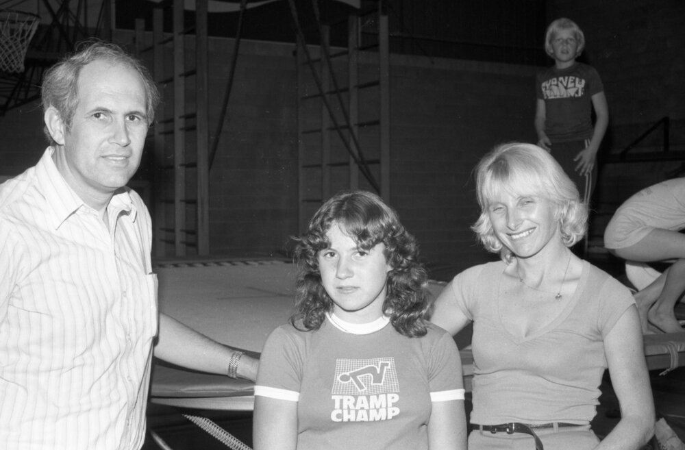 Unidentified Girl wearing a trampolining shirt with her parents, Ipswich, September 1980