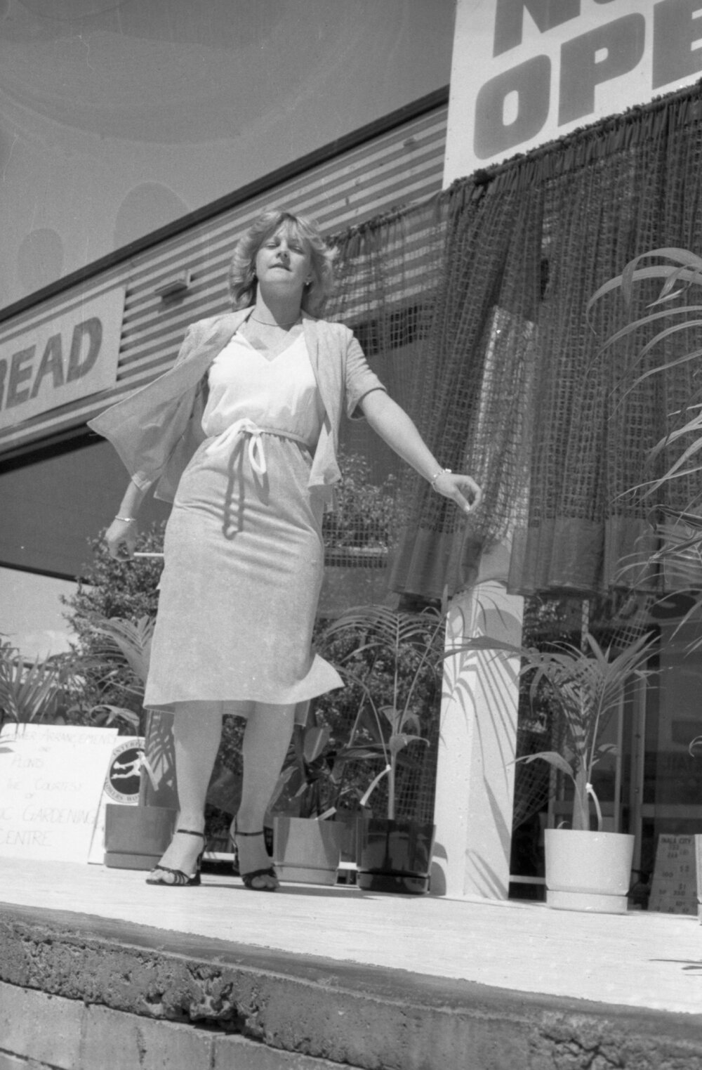 Unidentified woman modelling in a fashion show at an unidentified shopping complex, Ipswich, September 1980