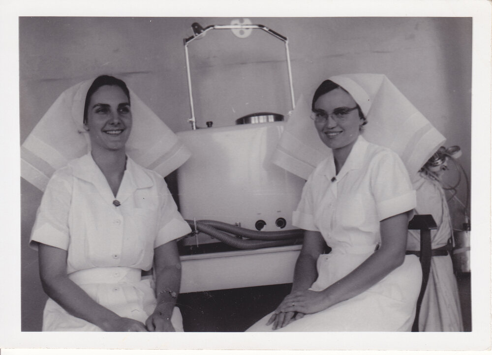 Nurses Sister Stevens and V Warren Birch with unidentified medical equipment, Ipswich General Hospital, Ipswich, 1950s