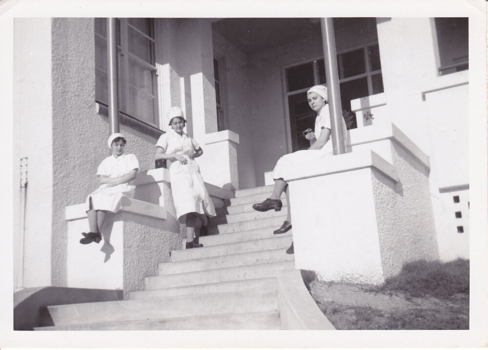 Nurses Sue Gardiner, Gloria Young, J Kerle on steps of Trumpy House, Ipswich Hospital, Ipswich, 1950s