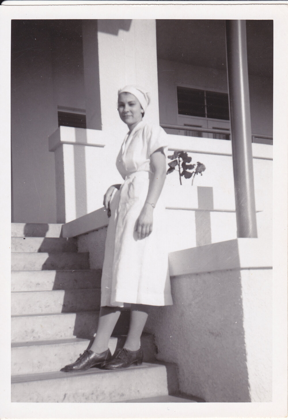 Nurse J Kerle on steps Trumpy House, Ipswich Hospital, Ipswich, 1950s