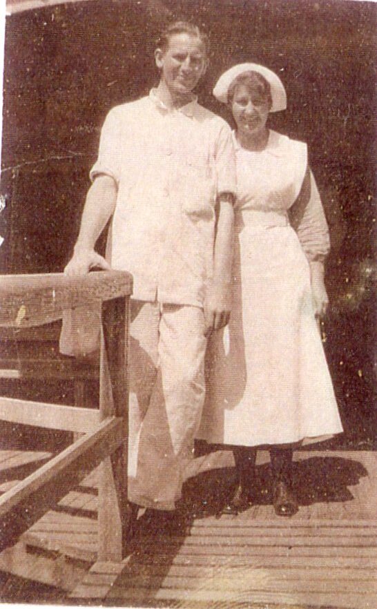 Unidentified nurse and man on verandah, Ipswich Hospital, Ipswich, c.1920