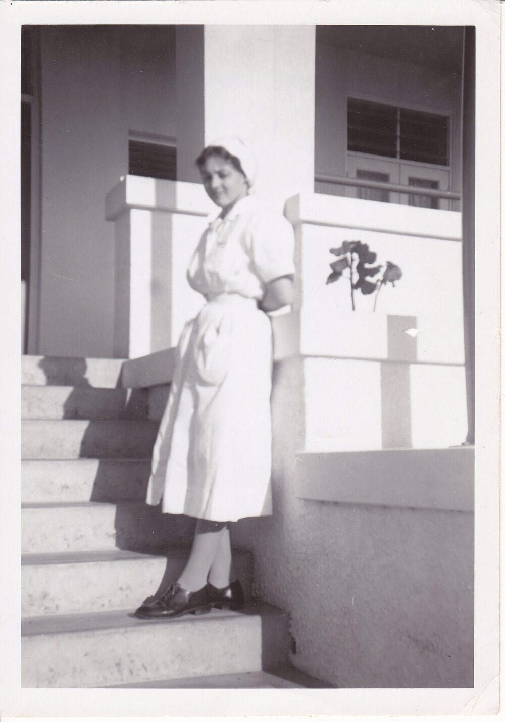 Nurse Sue Gardiner on steps Trumpy Home, Ipswich General Hospital, 1950s