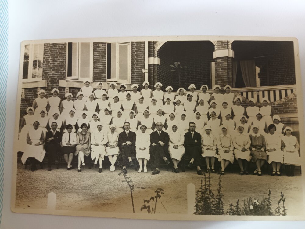 Hospital Staff photo outside original building, 1930s