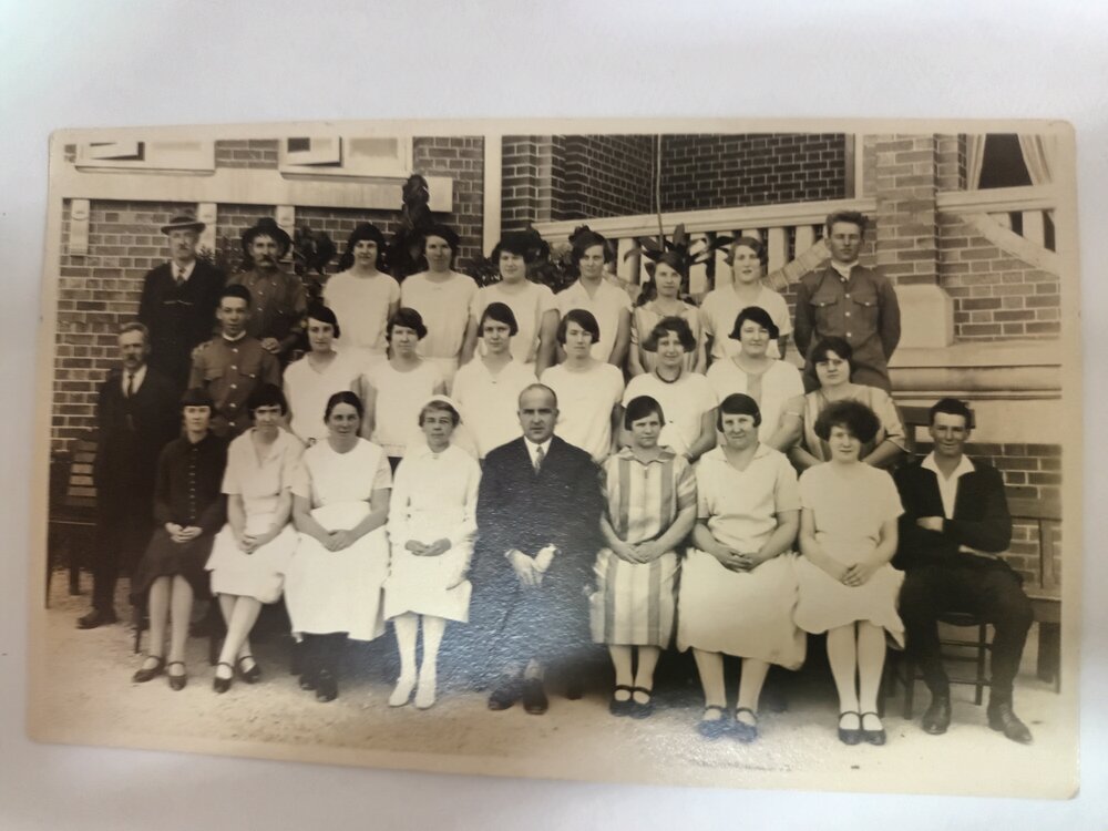 Hospital staff outside original building, 1930s