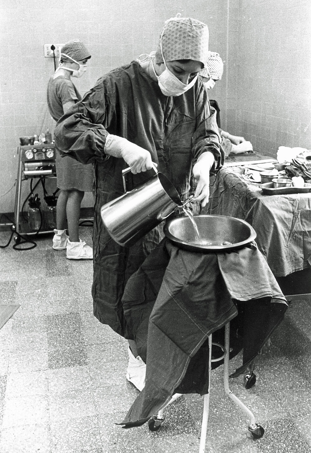 Elizabeth McNalty preparing sponge bowl, operating theatre, Ipswich Hospital, Ipswich, 1980s 