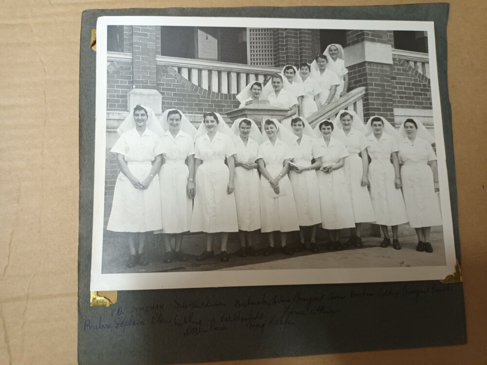 Nursing staff standing on the steps of the Sunshine Ward around Christmas, Ipswich Hospital, 1960s