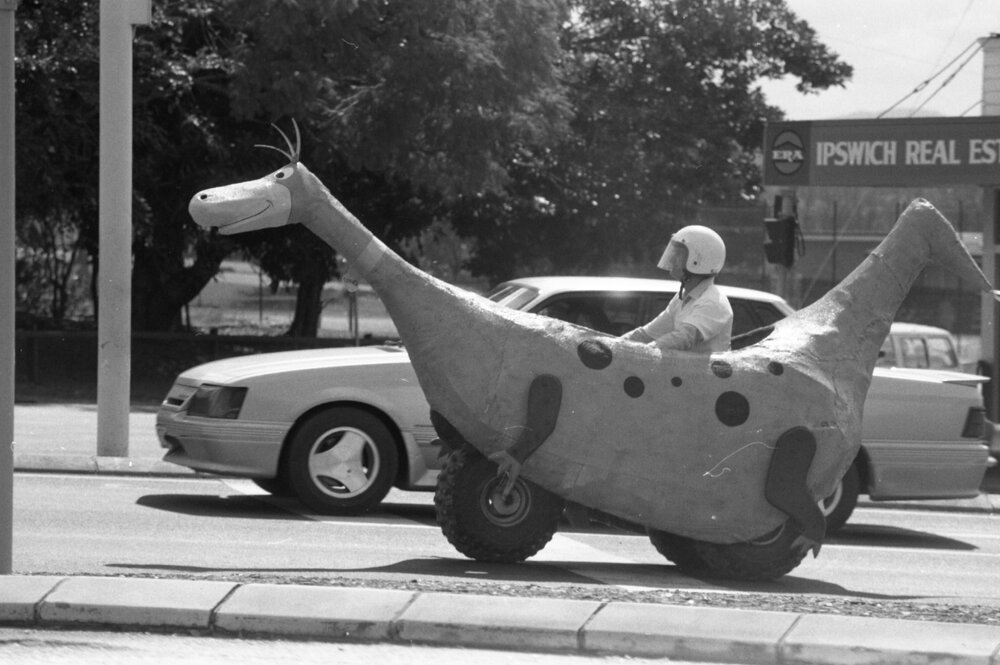 Dino the Snorkasaurus of the Flintsones parade float travelling in the Mall to Mall event to celebrate the opening of Ipswich City Mall, Ipswich, August 1987