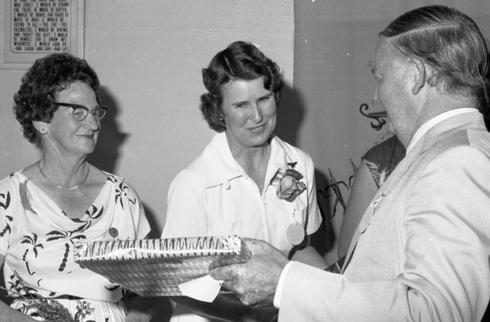 Beryl Wells receiving a gift from Mayor Desmond Freeman, Ipswich, September 1980