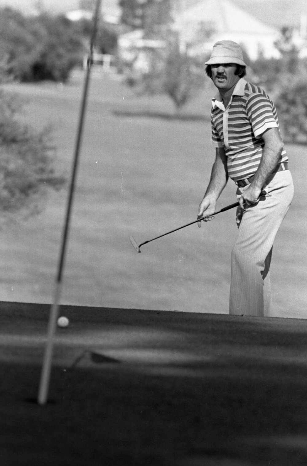 Unidentified golfer with a striped shirt, Ipswich, September 1980