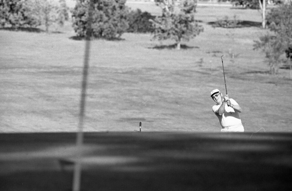 Unidentified golfer with cap and white shirt, Ipswich, September 1980