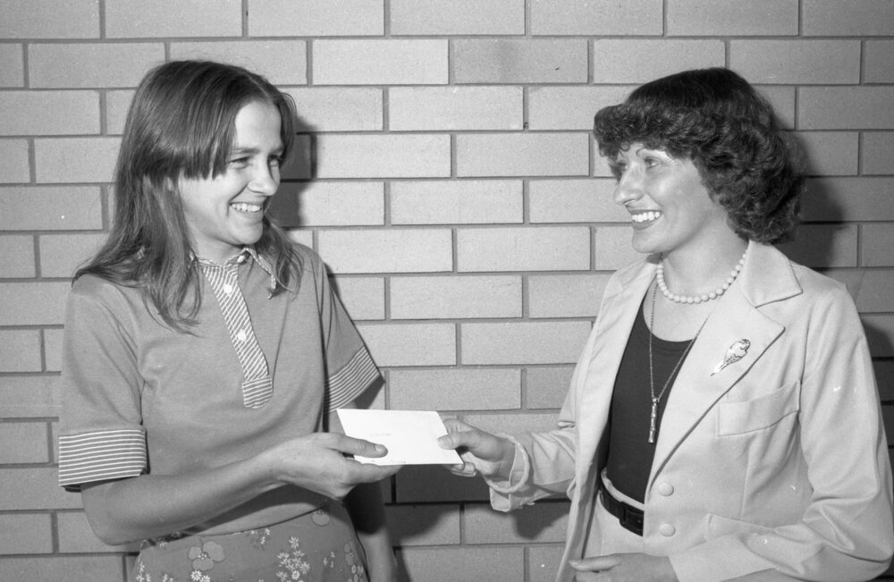 Unidentified woman receiving prize drawn at Ipswich Turf Club, Ipswich, September 1980